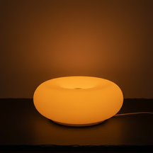 Orange donut table lamp with warm ambient light