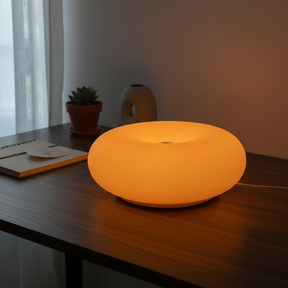 Dimmable LED donut table lamp in a modern interior